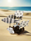Four White Fish On Driftwood
