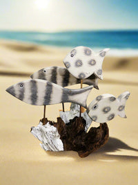 Four White Fish On Driftwood