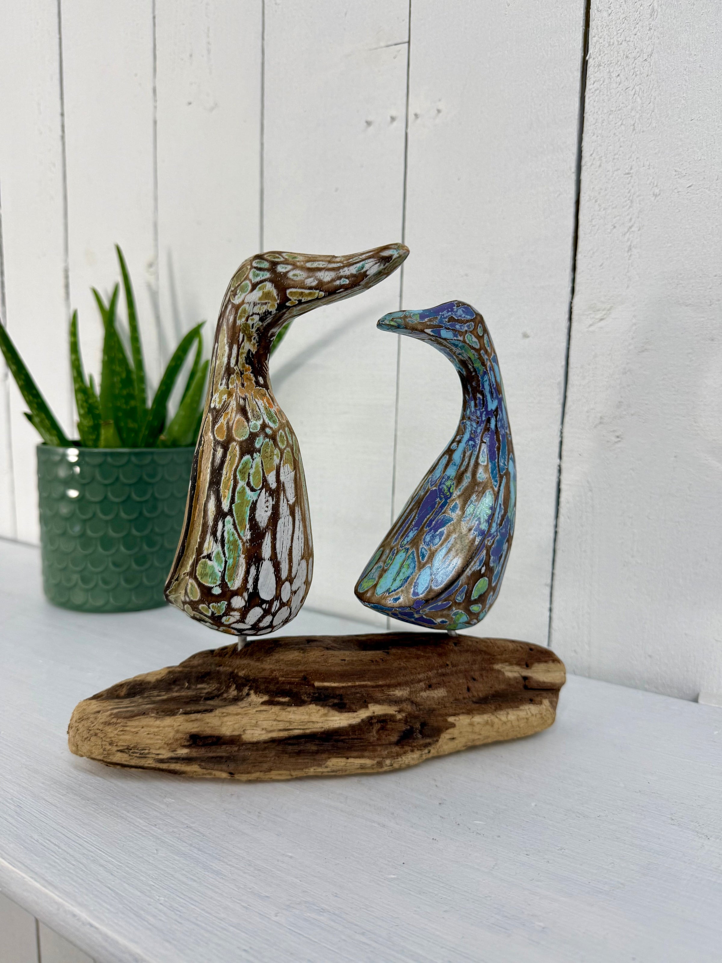 Two Ducks on Driftwood