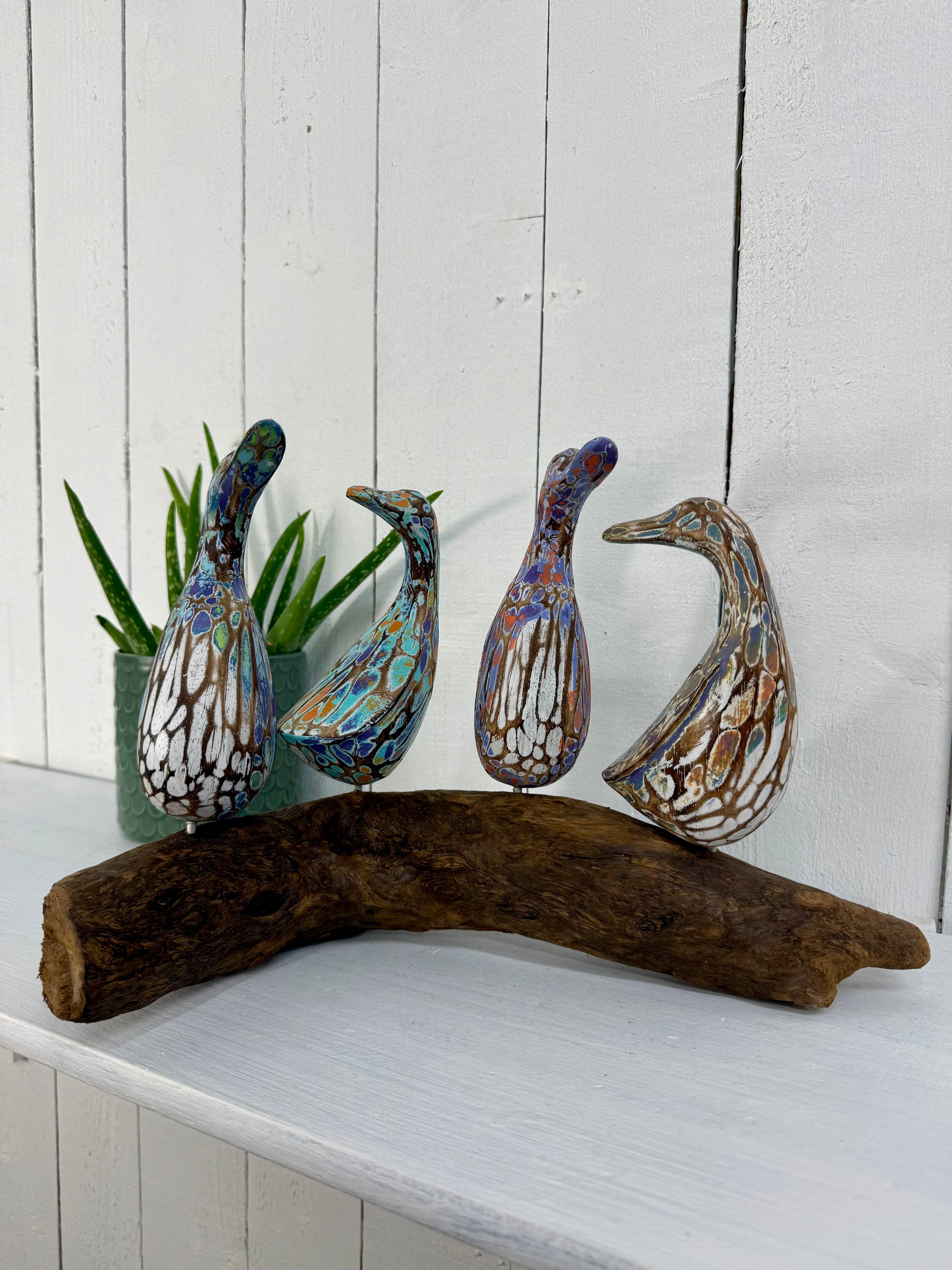 Four Ducks on Driftwood