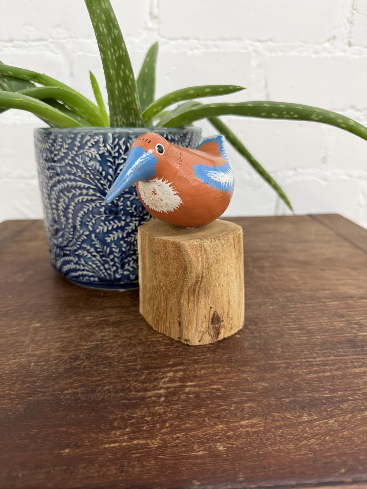 Orange Bird On Driftwood Stand