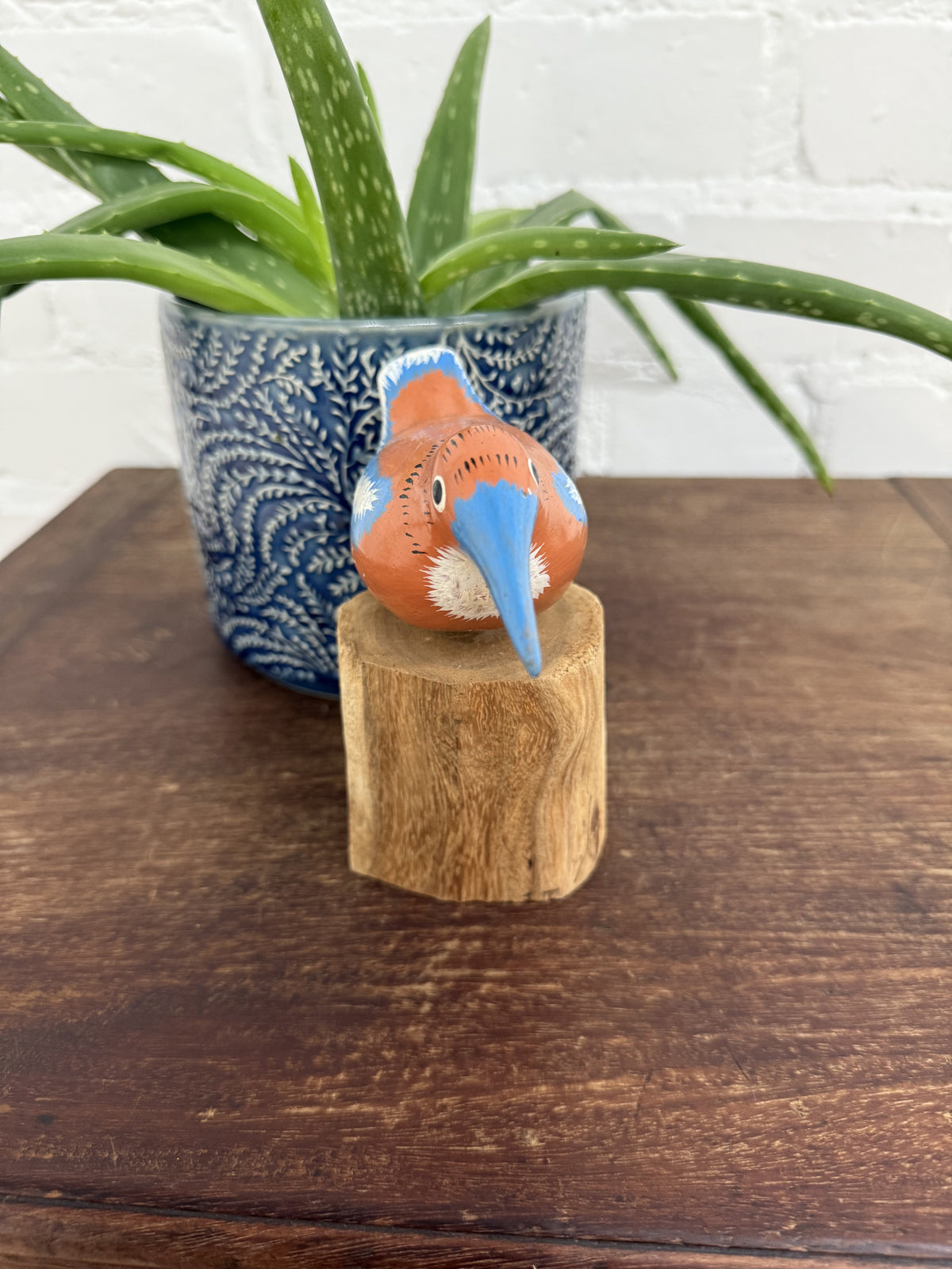 Orange Bird On Driftwood Stand