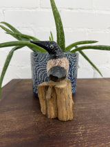 Black Bird On Driftwood Stand