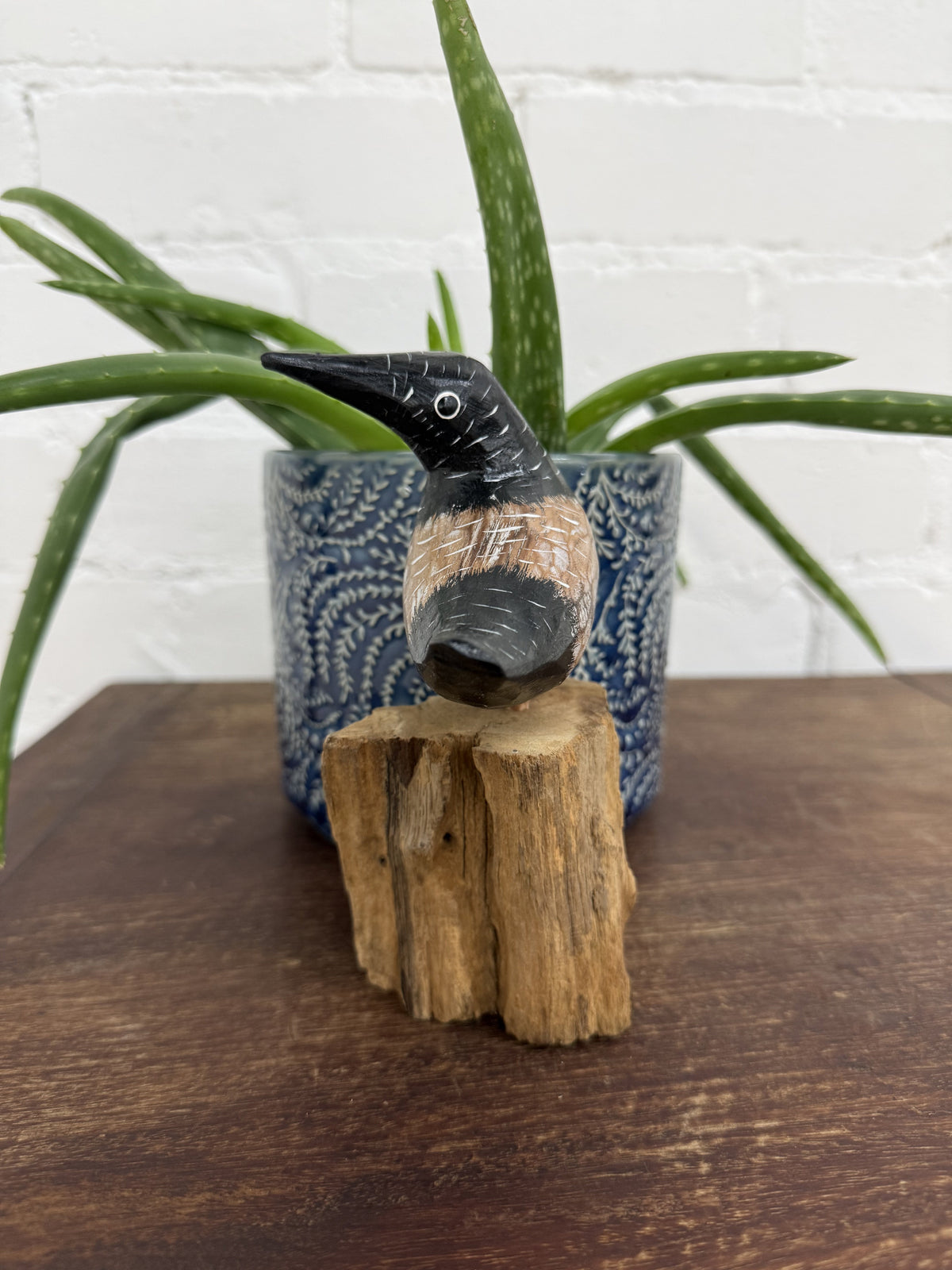 Black Bird On Driftwood Stand
