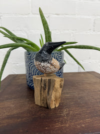 Black Bird On Driftwood Stand