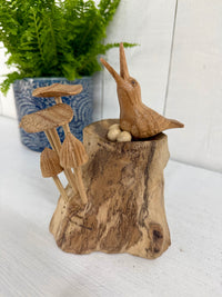 Wooden Bird in Nest with Mushrooms