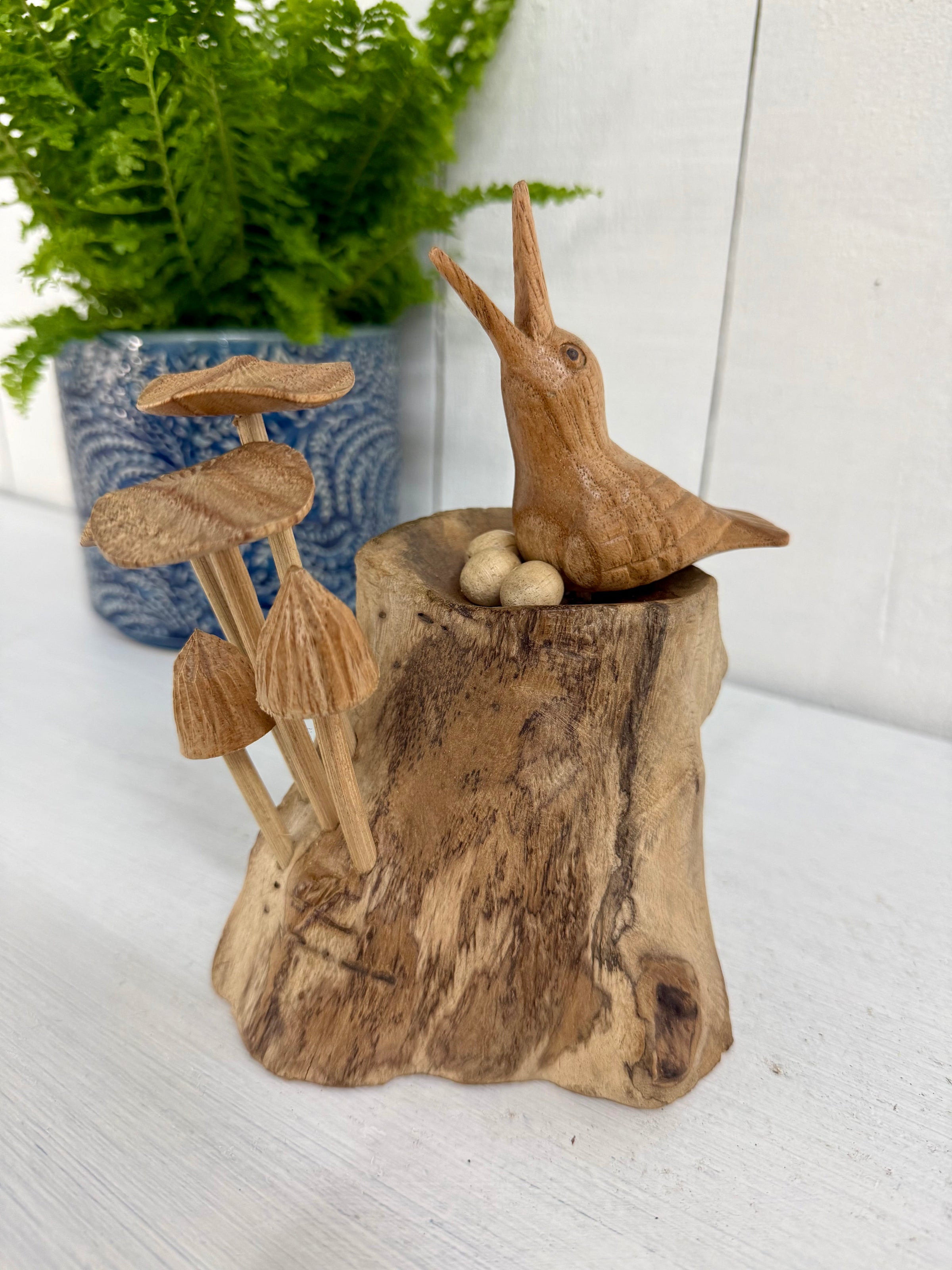 Wooden Bird in Nest with Mushrooms