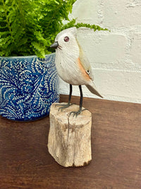 Small Wooden Bird on Log