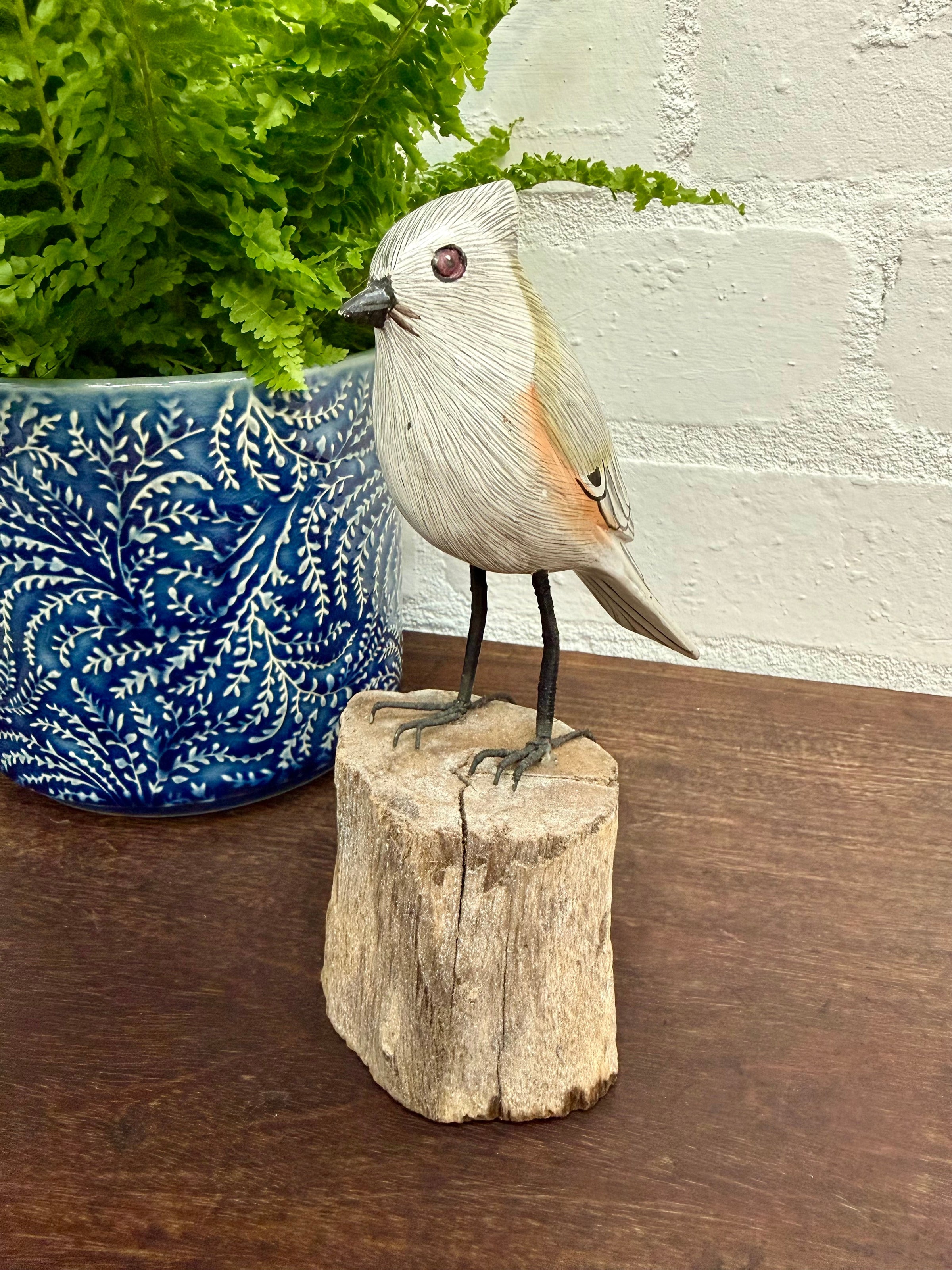 Small Wooden Bird on Log