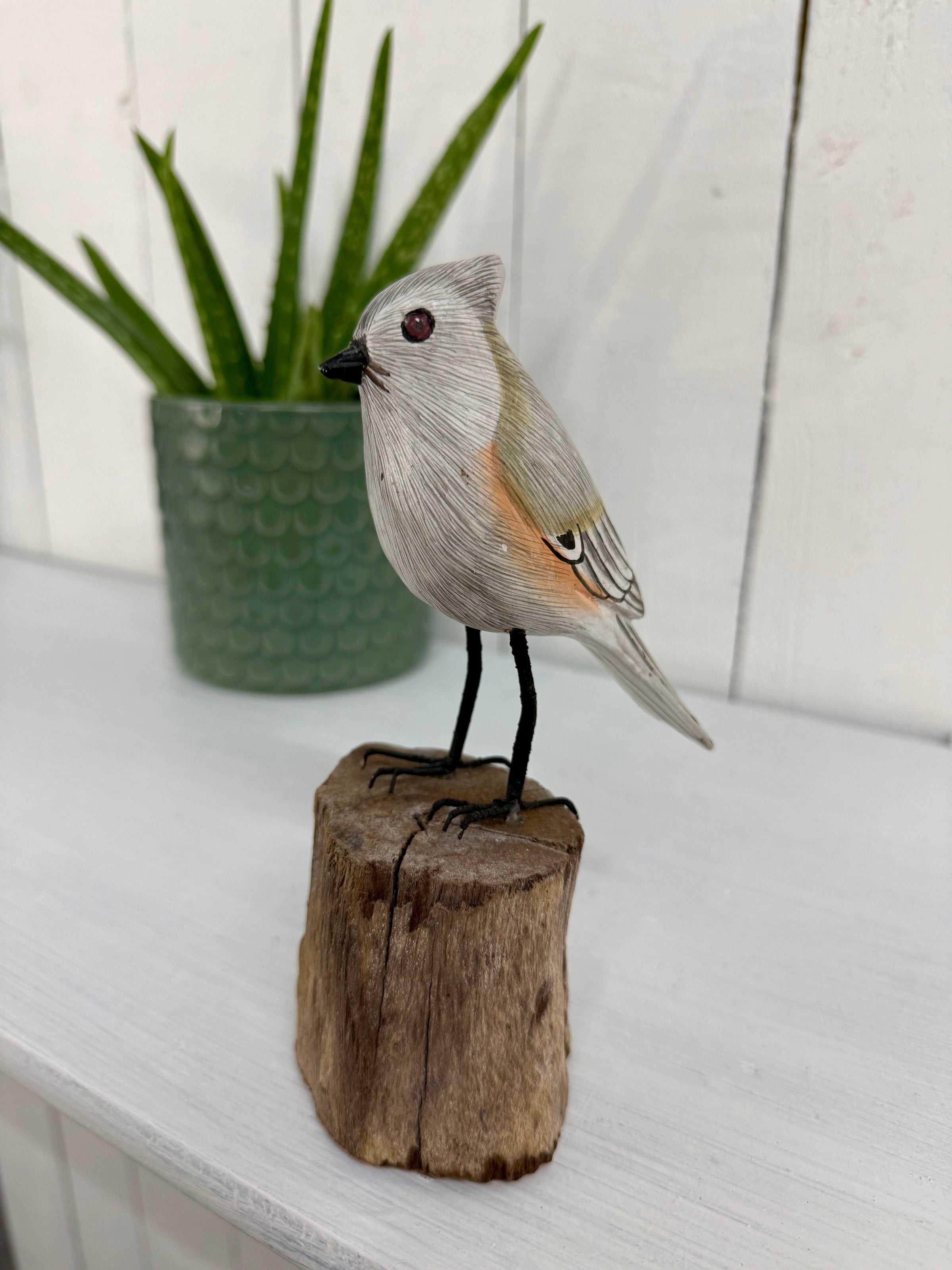 Small Wooden Bird on Log