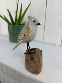 Small Wooden Bird on Log