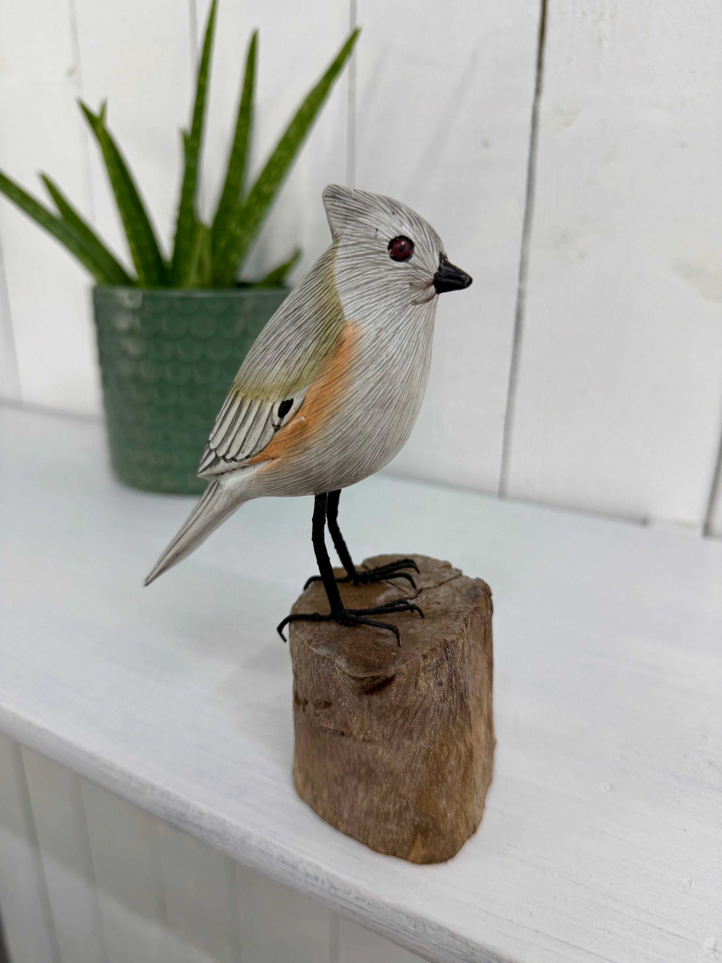 Small Wooden Bird on Log