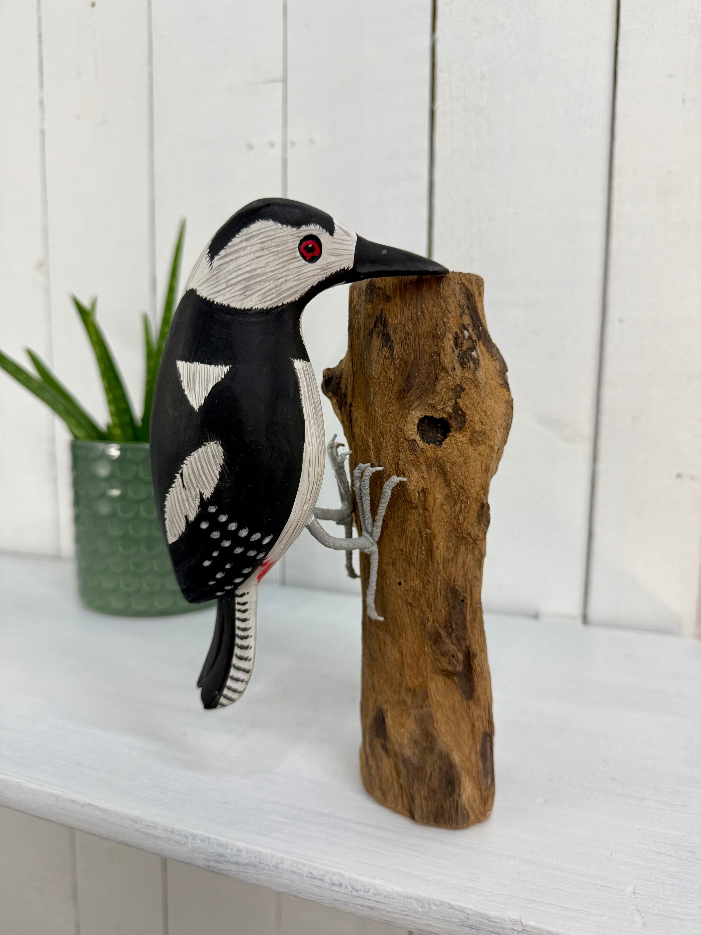 Wooden Woodpecker on Log