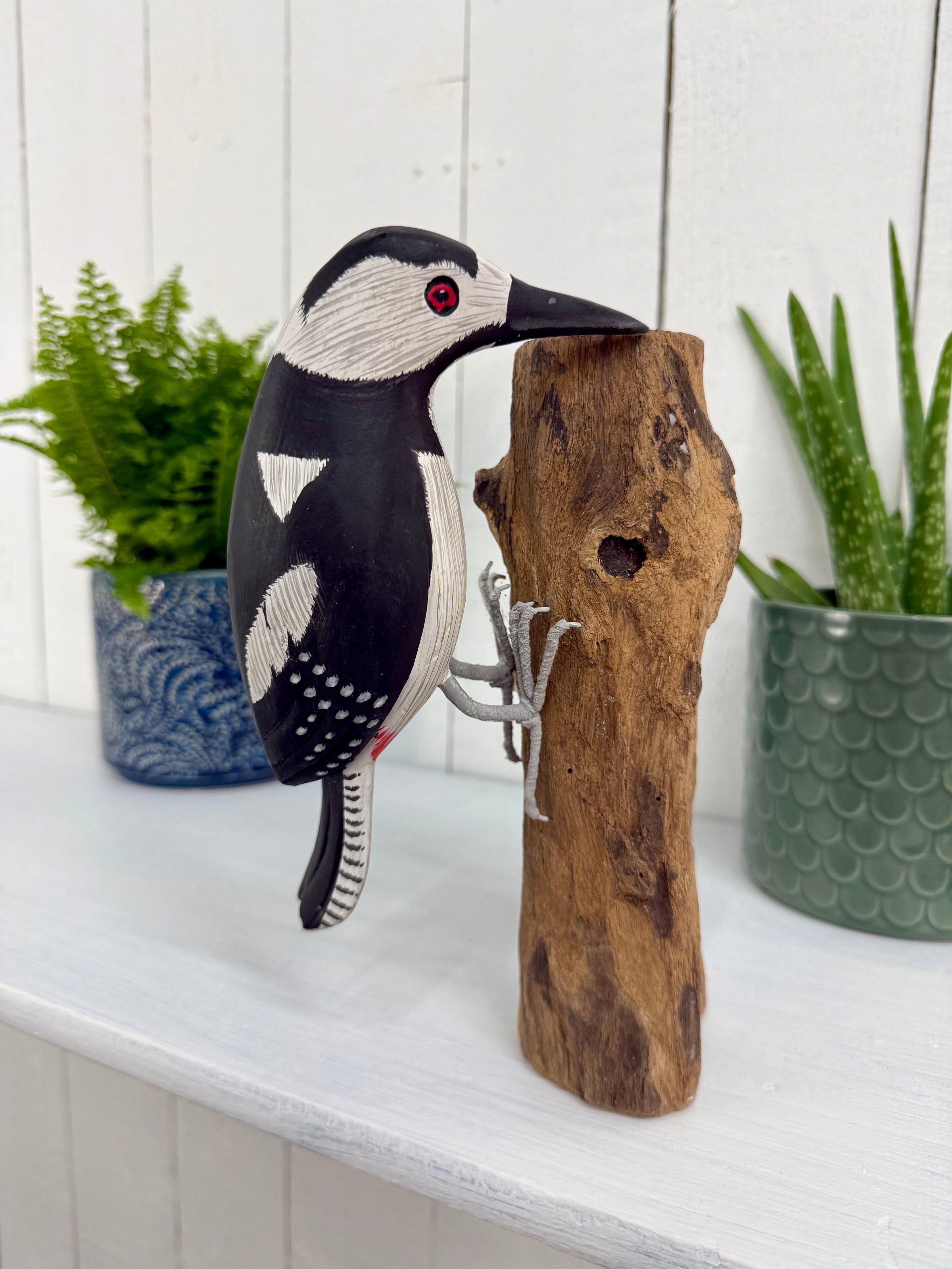 Wooden Woodpecker on Log