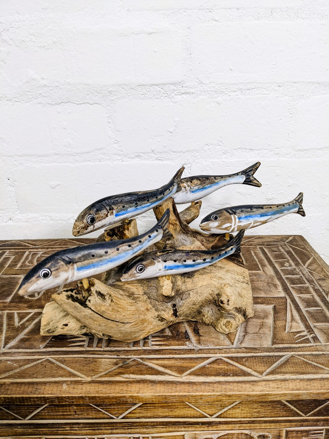 Five Silver Fish On Driftwood